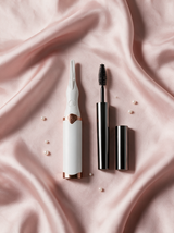Lily Lash heated eyelash curler and Magic Mascara on blush silk