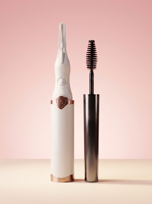 Lily Lash heated eyelash curler and Magic Mascara on a blush studio backdrop